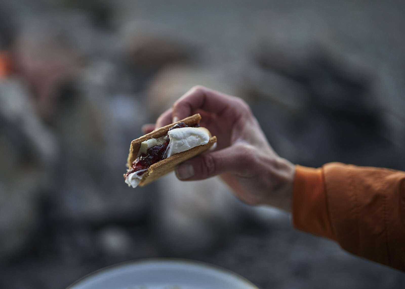 holding white chocolate s'mores