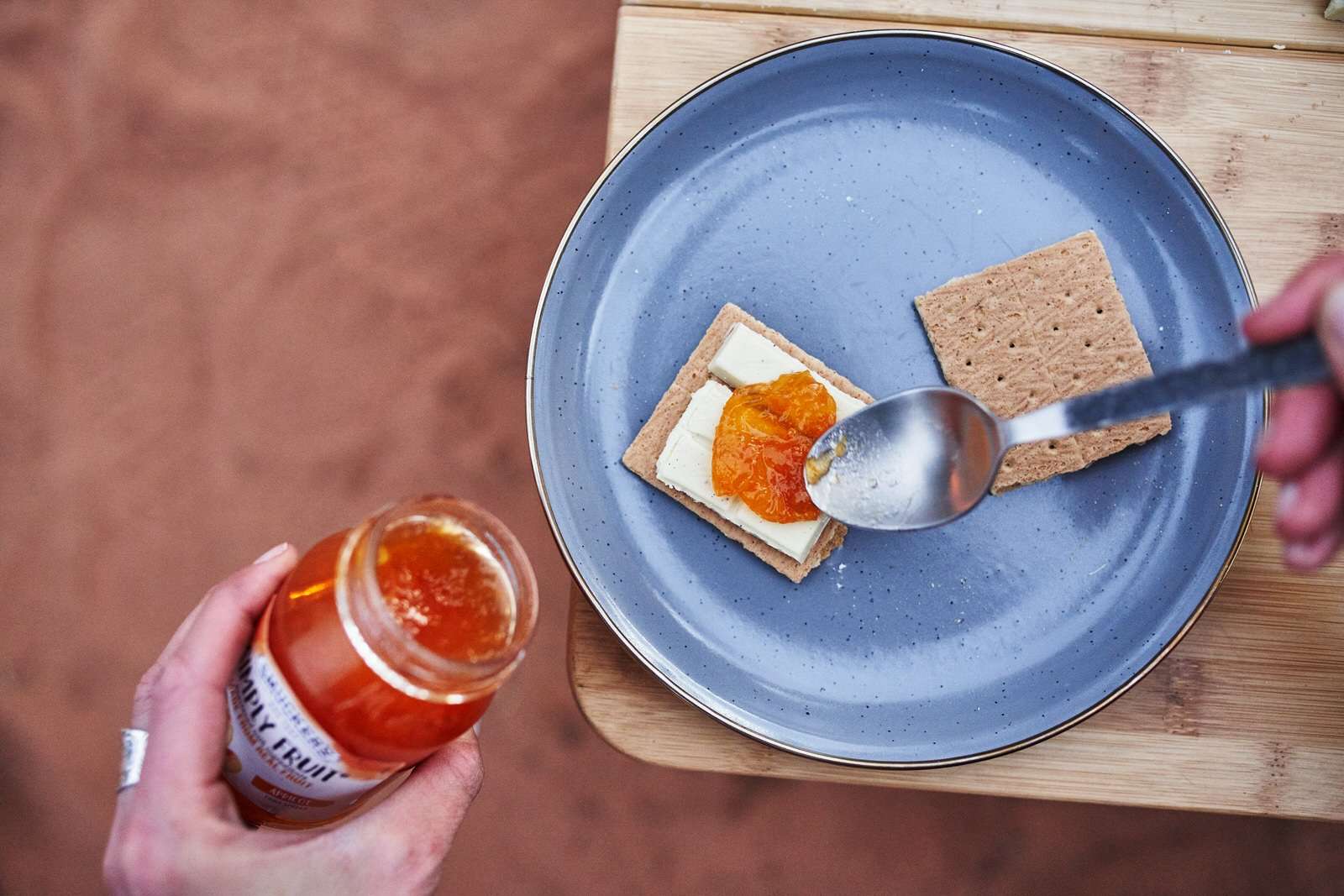 Adding apricot jelly to the s’mores