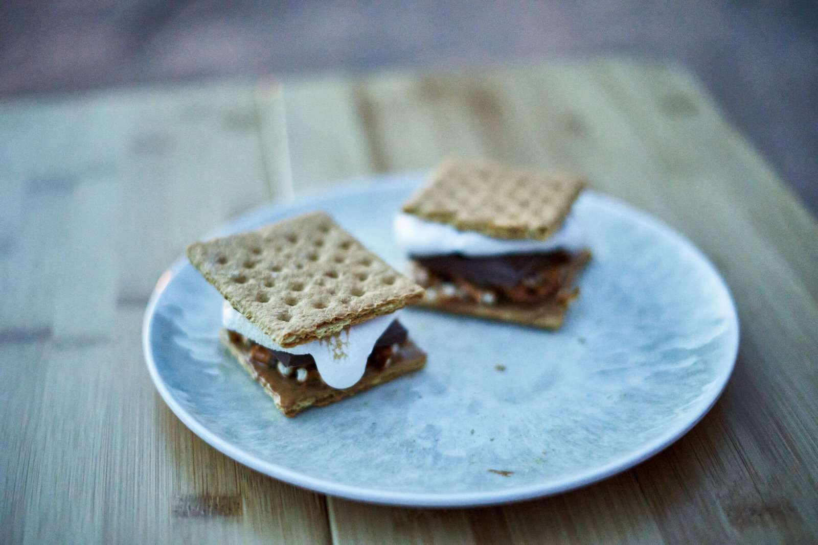 two peanut butter smores on a plate at camp