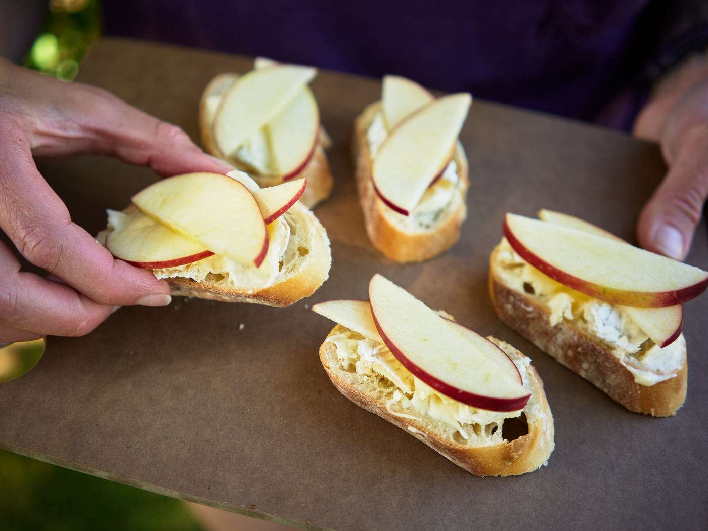 crostini topped with brie cheese and sliced apples