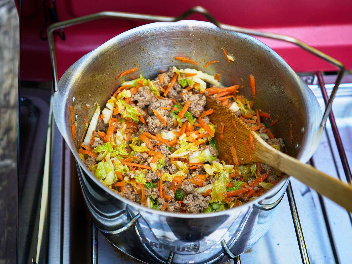 cooking the beef, cabbage, and carrots