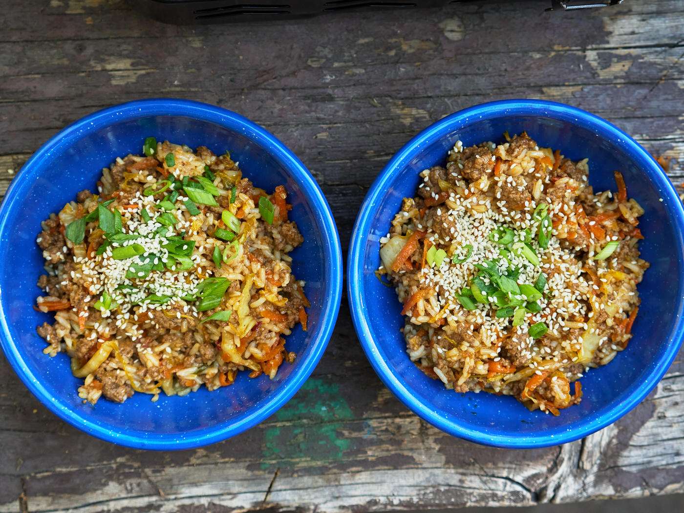 two bowls of Sweet Ginger Chili Beef and Cabbage for a camping dinner