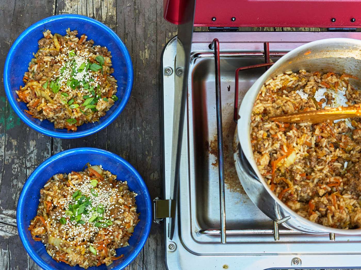 camping propane stove with an easy one pot dinner and two serving bowls 