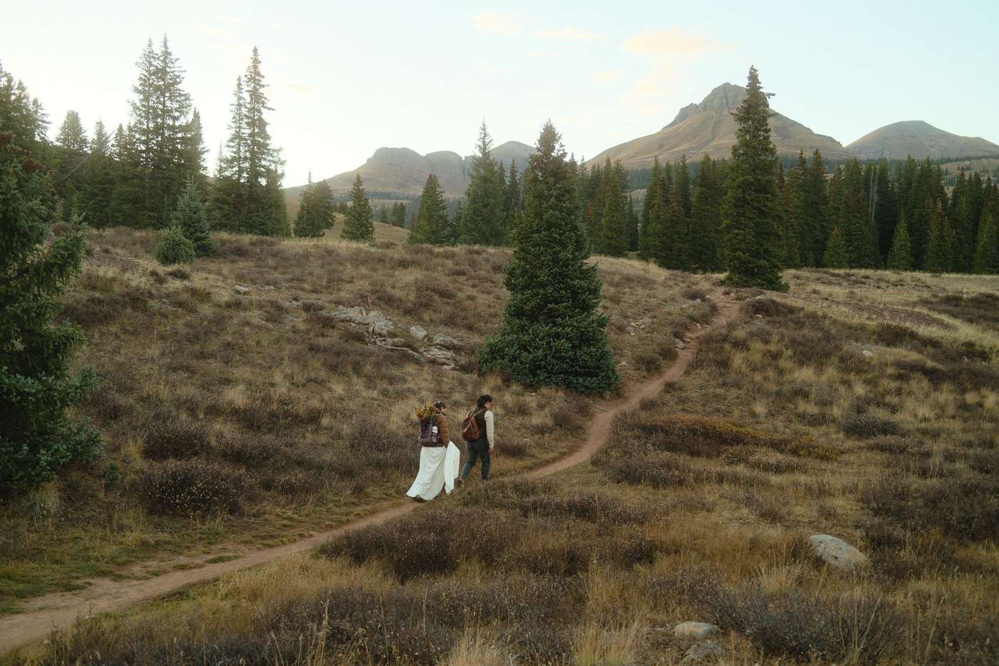 hiking on the trail in Colorado after the wedding ceremony 