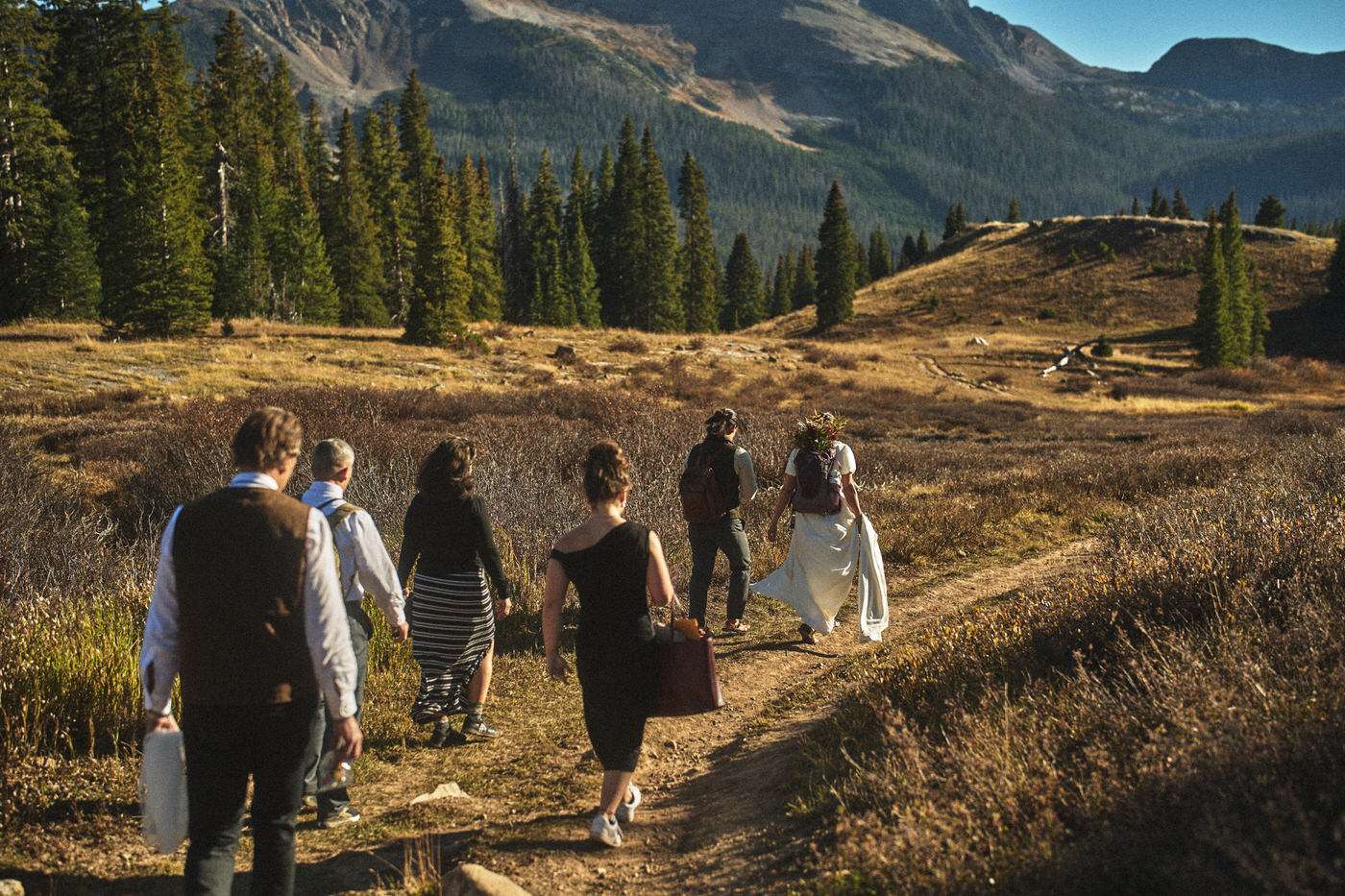 everyone hiking to the wedding ceremony location 