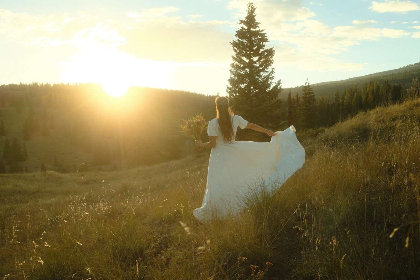 bride at sunset in an a-line wedding dress outdoors