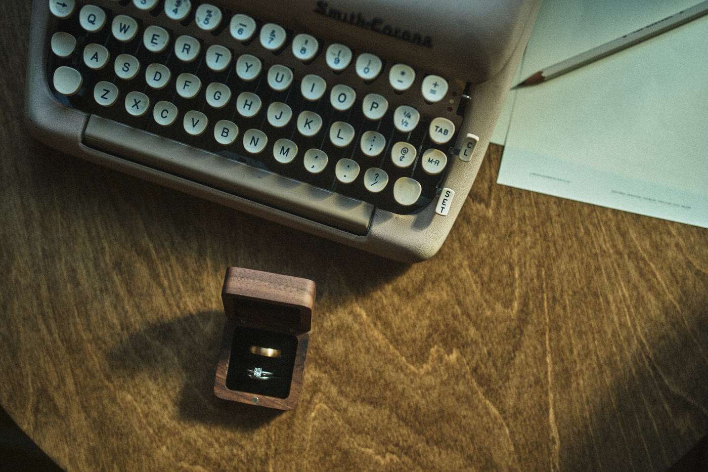 wedding rings in a wooden box on a table 