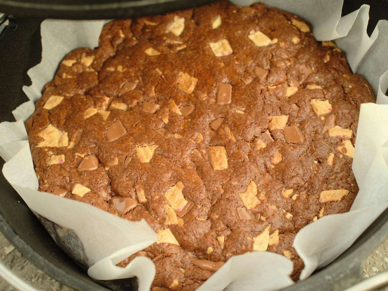 close up of chocolate peppermint cookie bars in a dutch oven while camping
