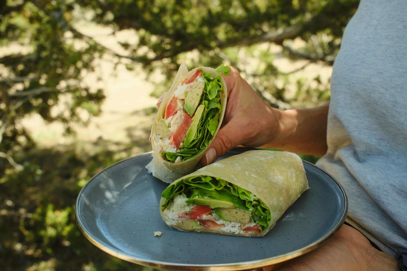 chicken caesar wraps with lettuce, tomato, and avocado