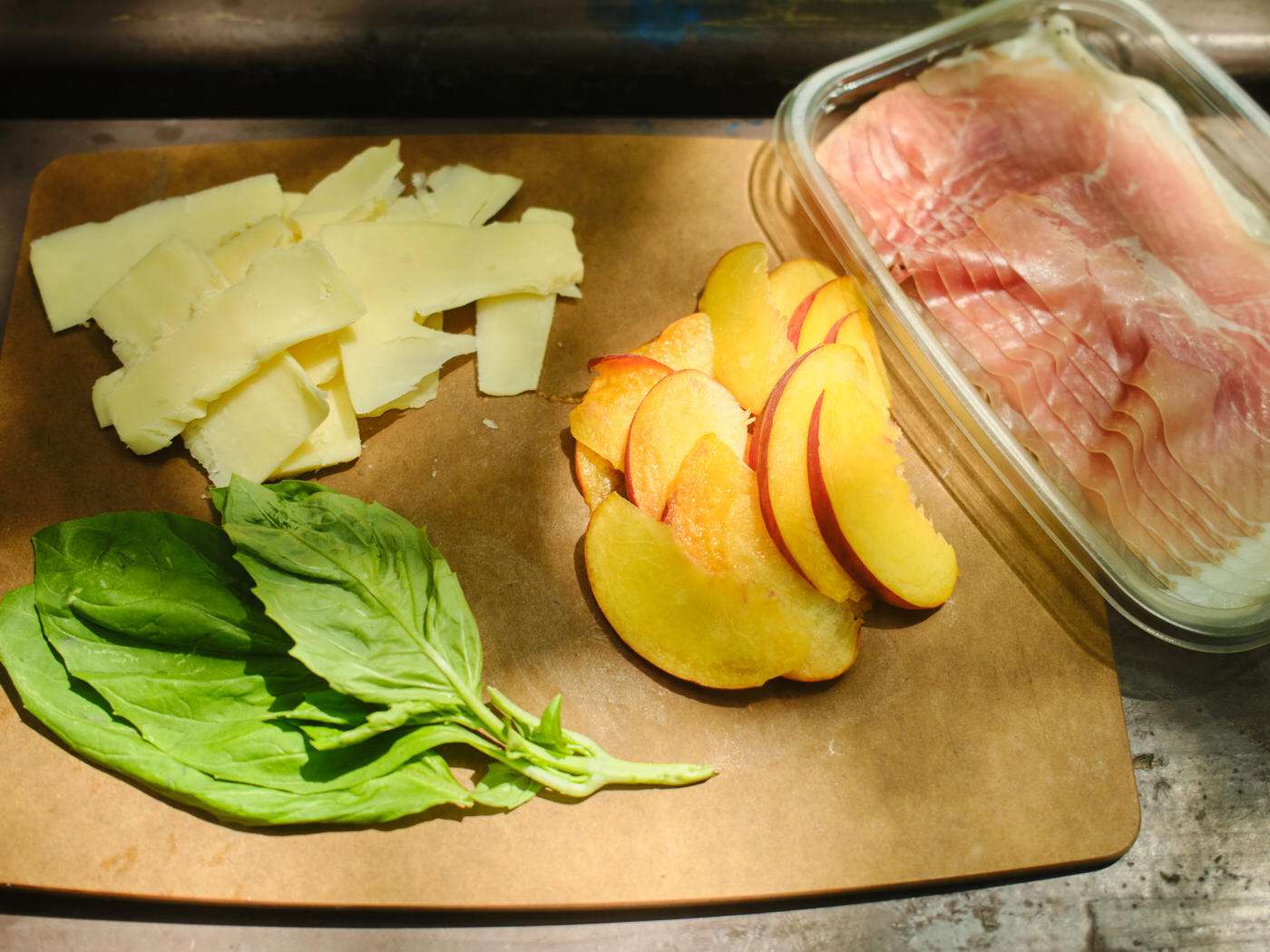 peach grilled cheese ingredients on a picnic table outside