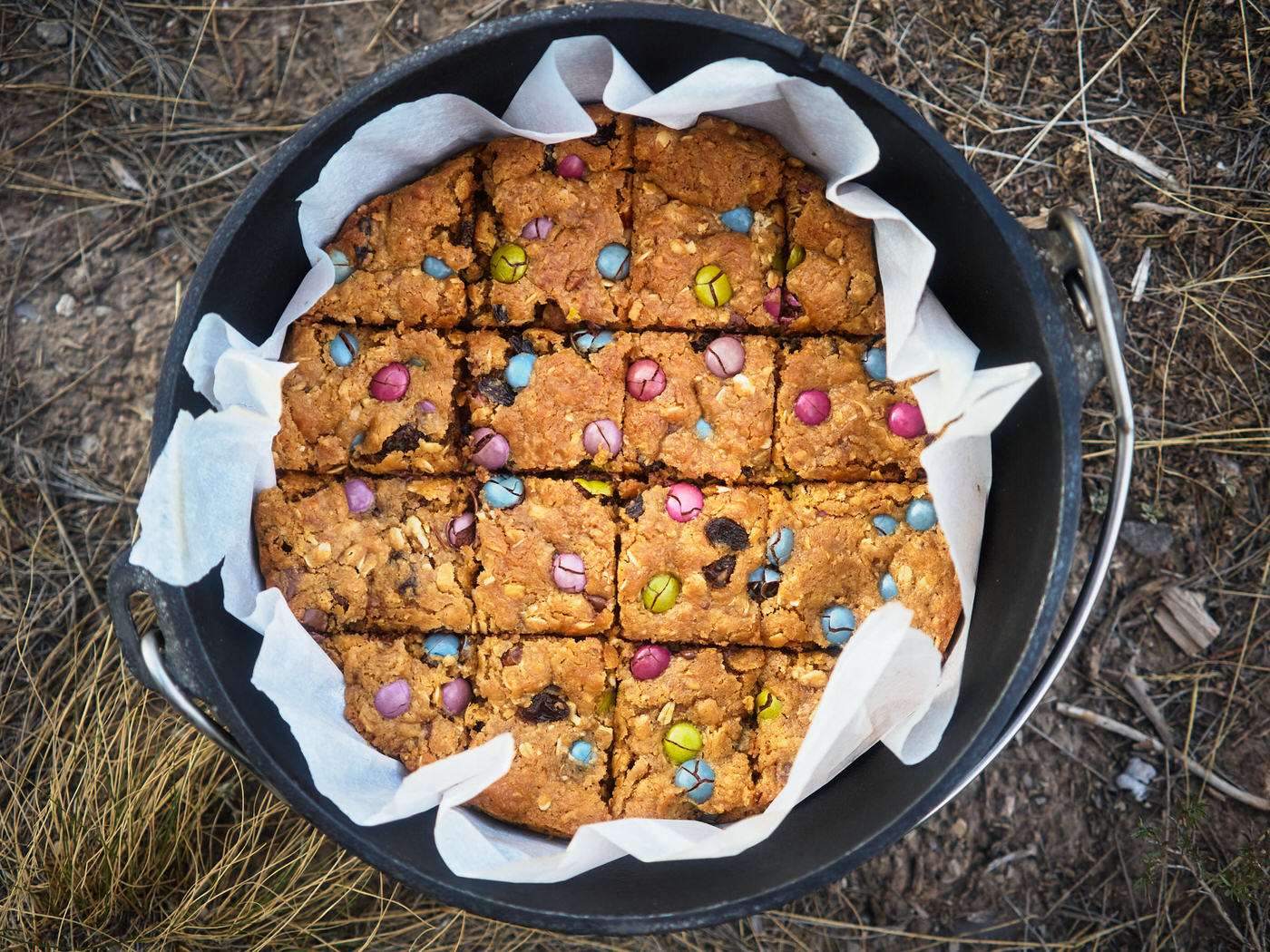 dutch oven with baked trail mix cookie bars camping