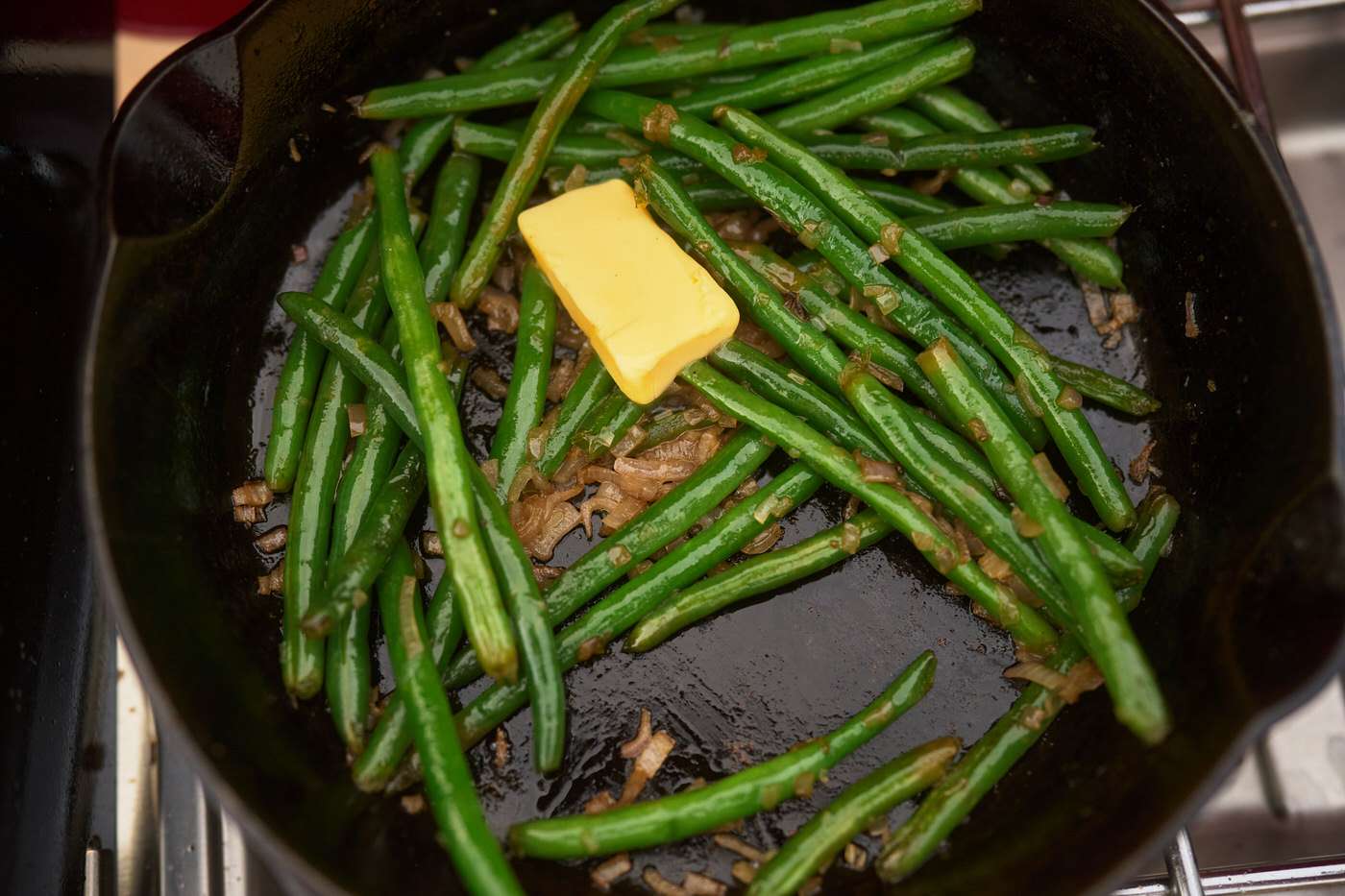 green beans and butter in a cast iron skillet