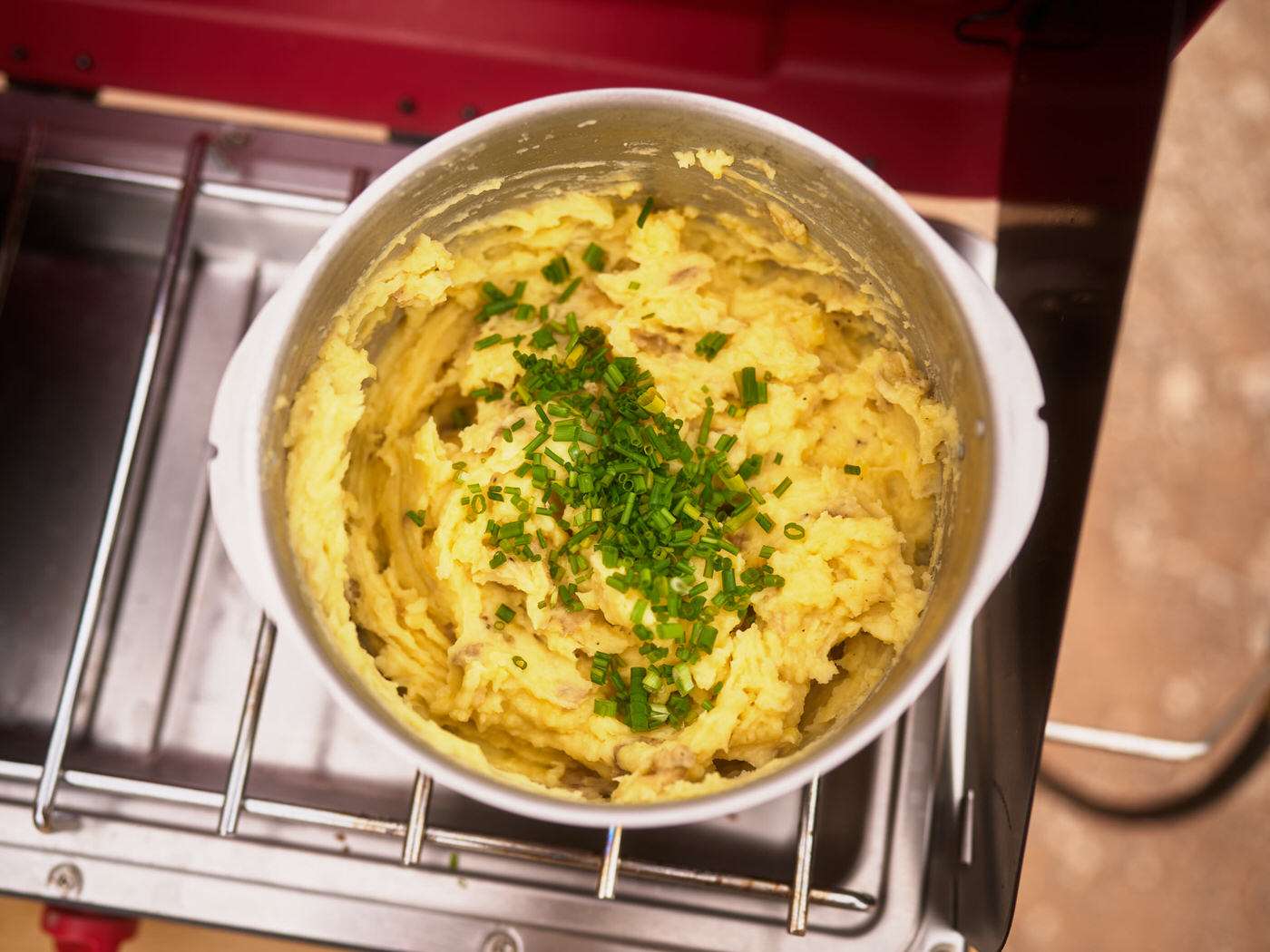 pot of mashed potatoes on a propane camp stove