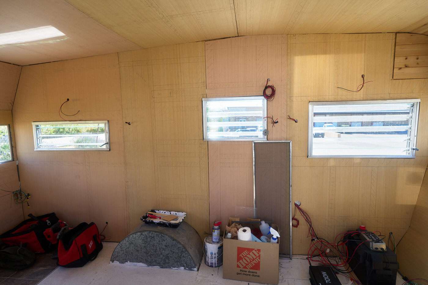 the interior side wall of our 1960s camper after the new wall panels were installed