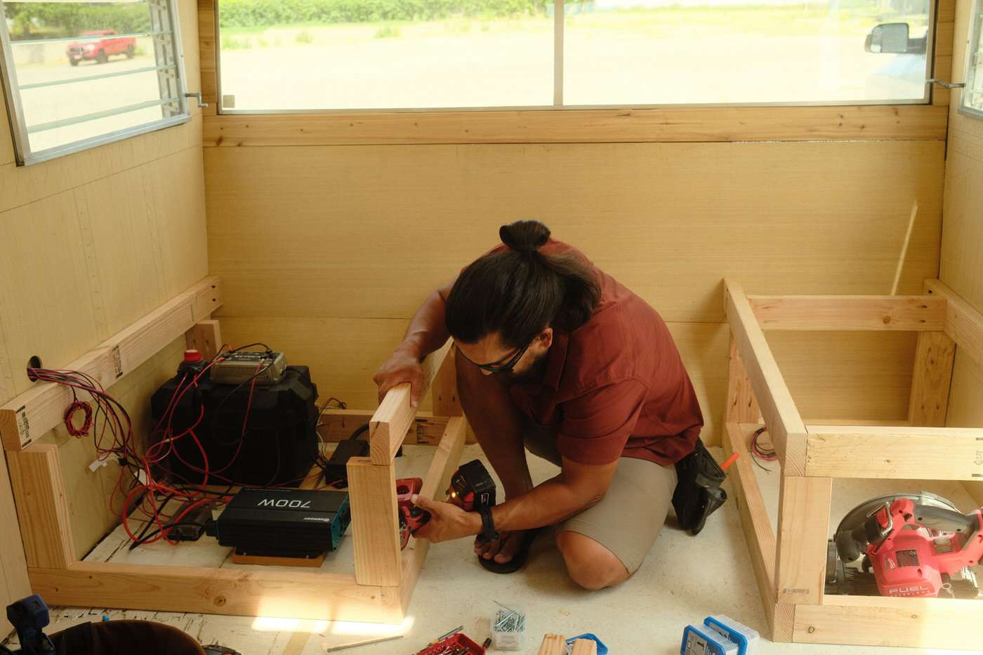 Nick rebuilding the benches to the original trailer layout size