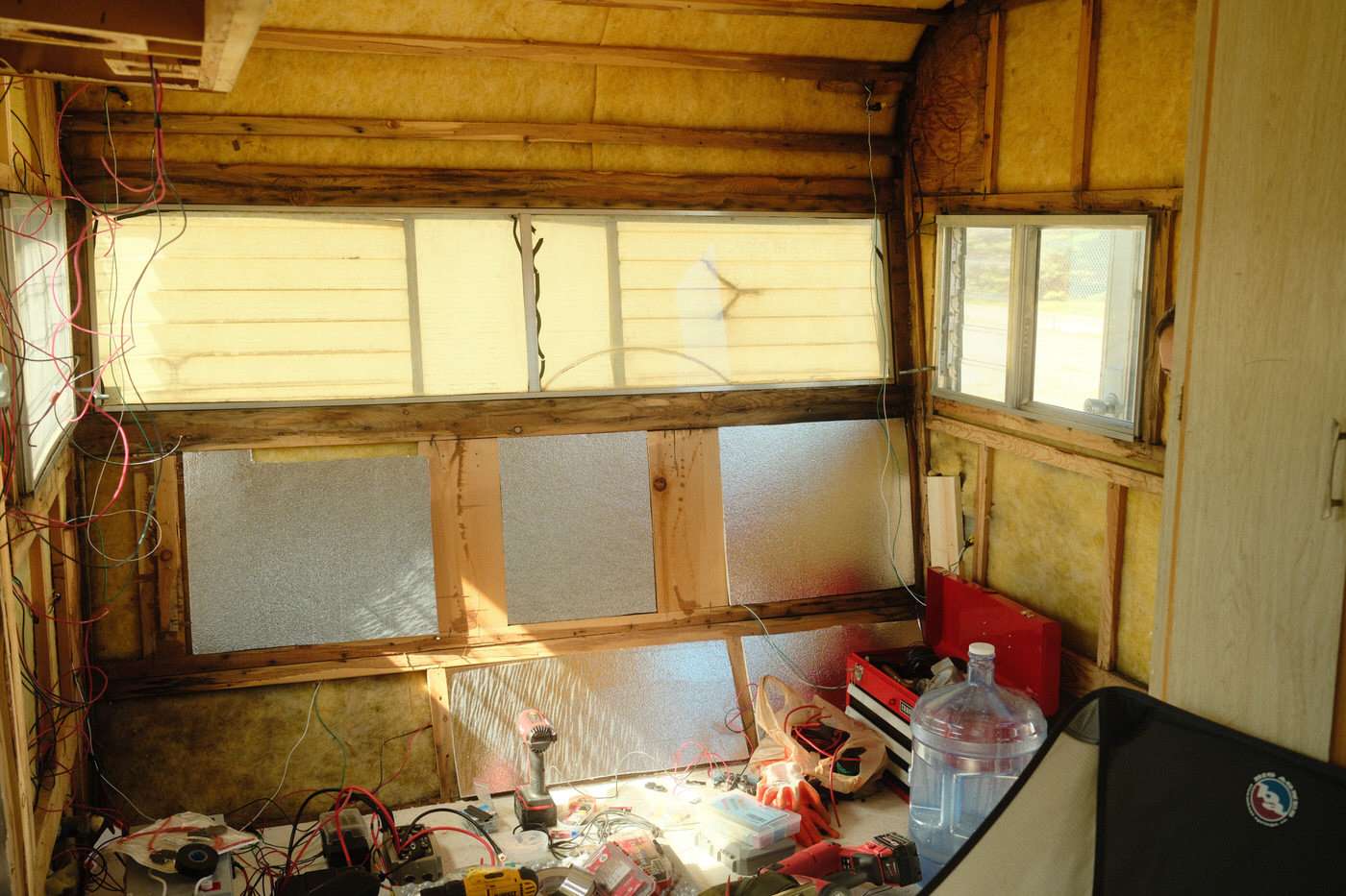 installing new insulation in our 1960s vintage camping trailer after the demo