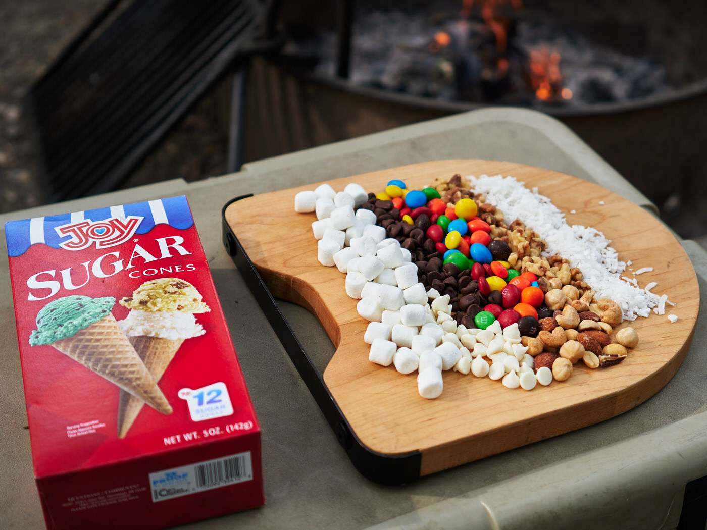 Ingredients needed to make campfire cones while camping including a box of waffle cones and marshmallows