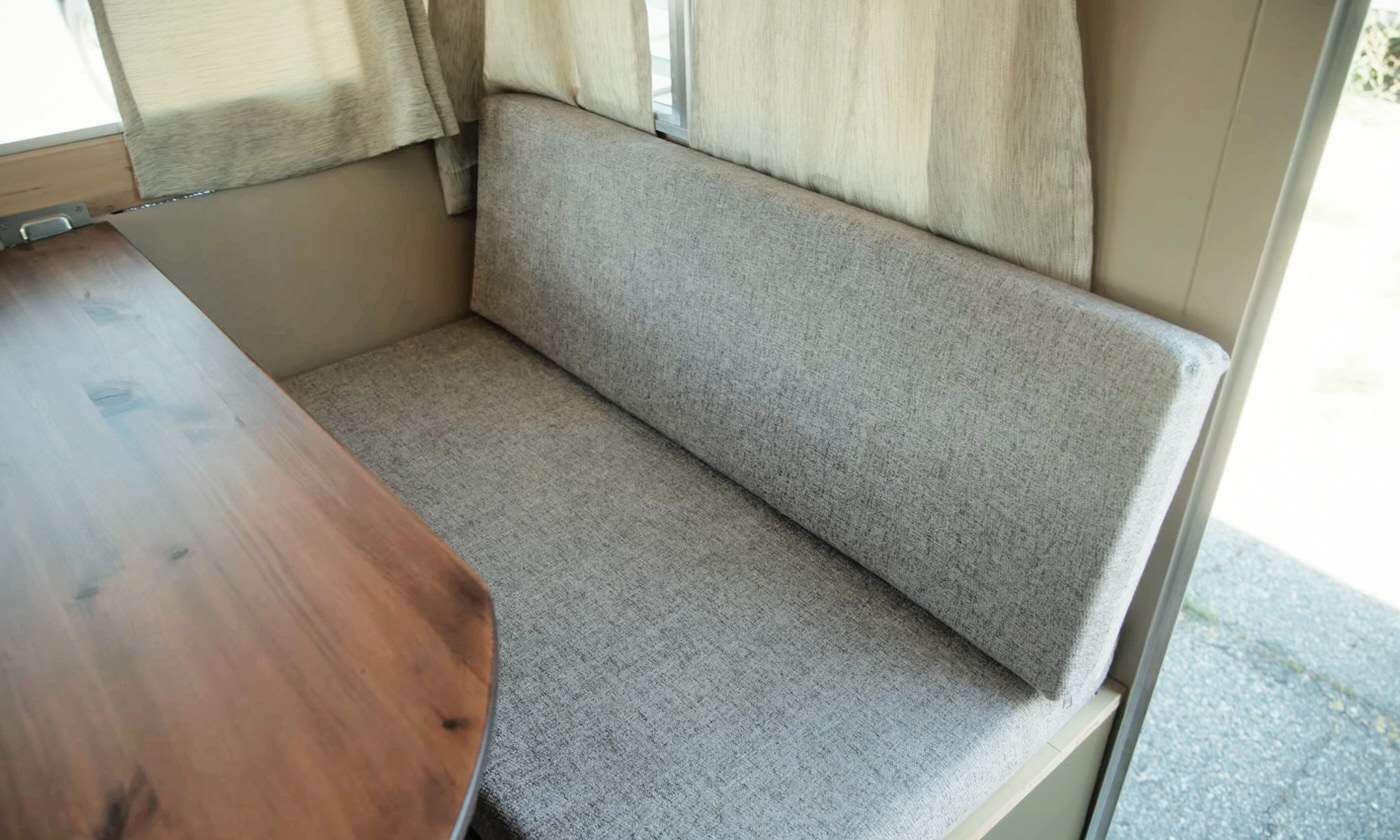 Homemade diy cushions in a small camper interior design
