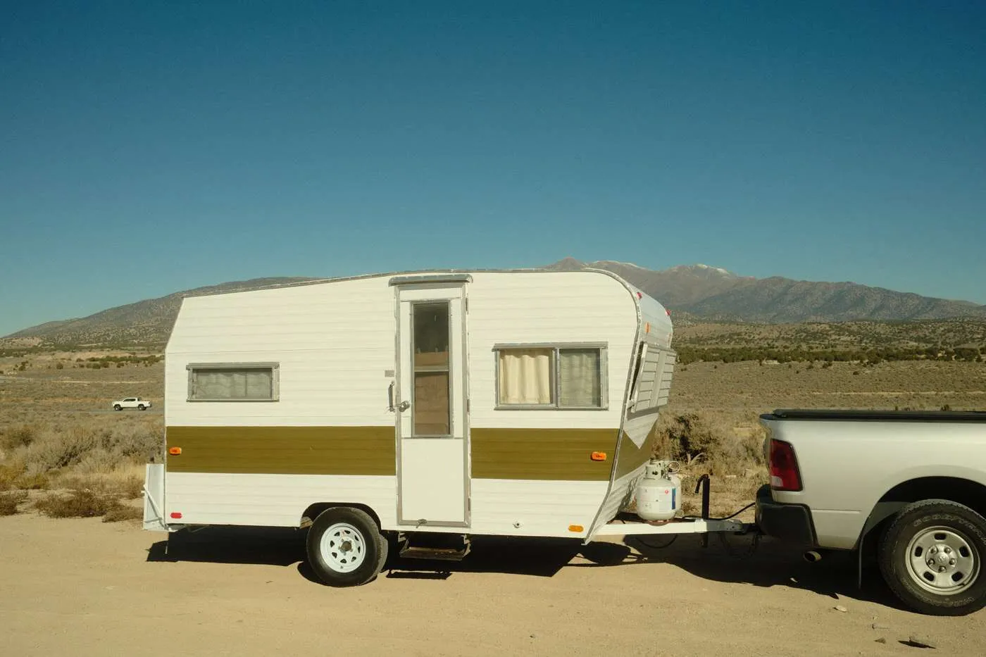 vintage camper renovation exterior DIY paint job and new tires 