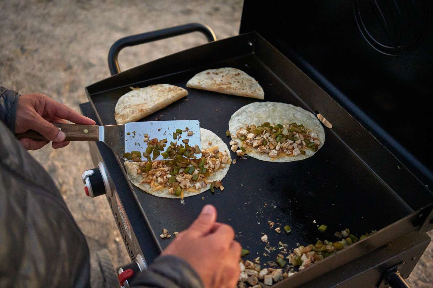 cooking chicken quesadillas for an easy blackstone camping recipe 